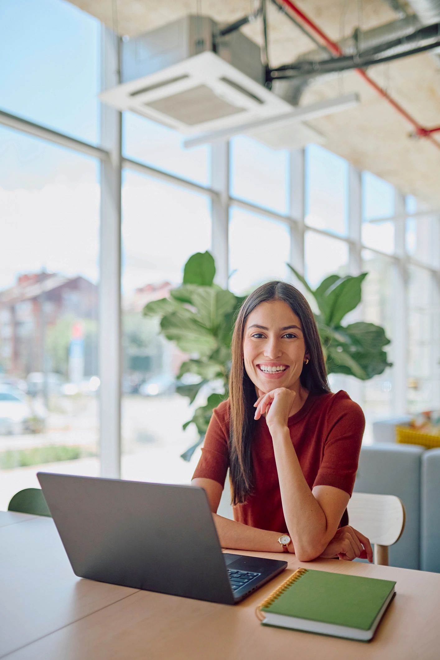 Professional working on a laptop in a modern office