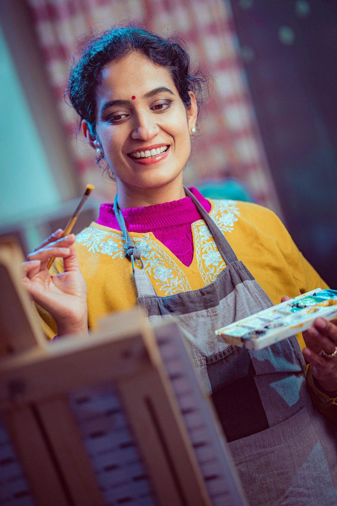 Founder painting in a creative studio